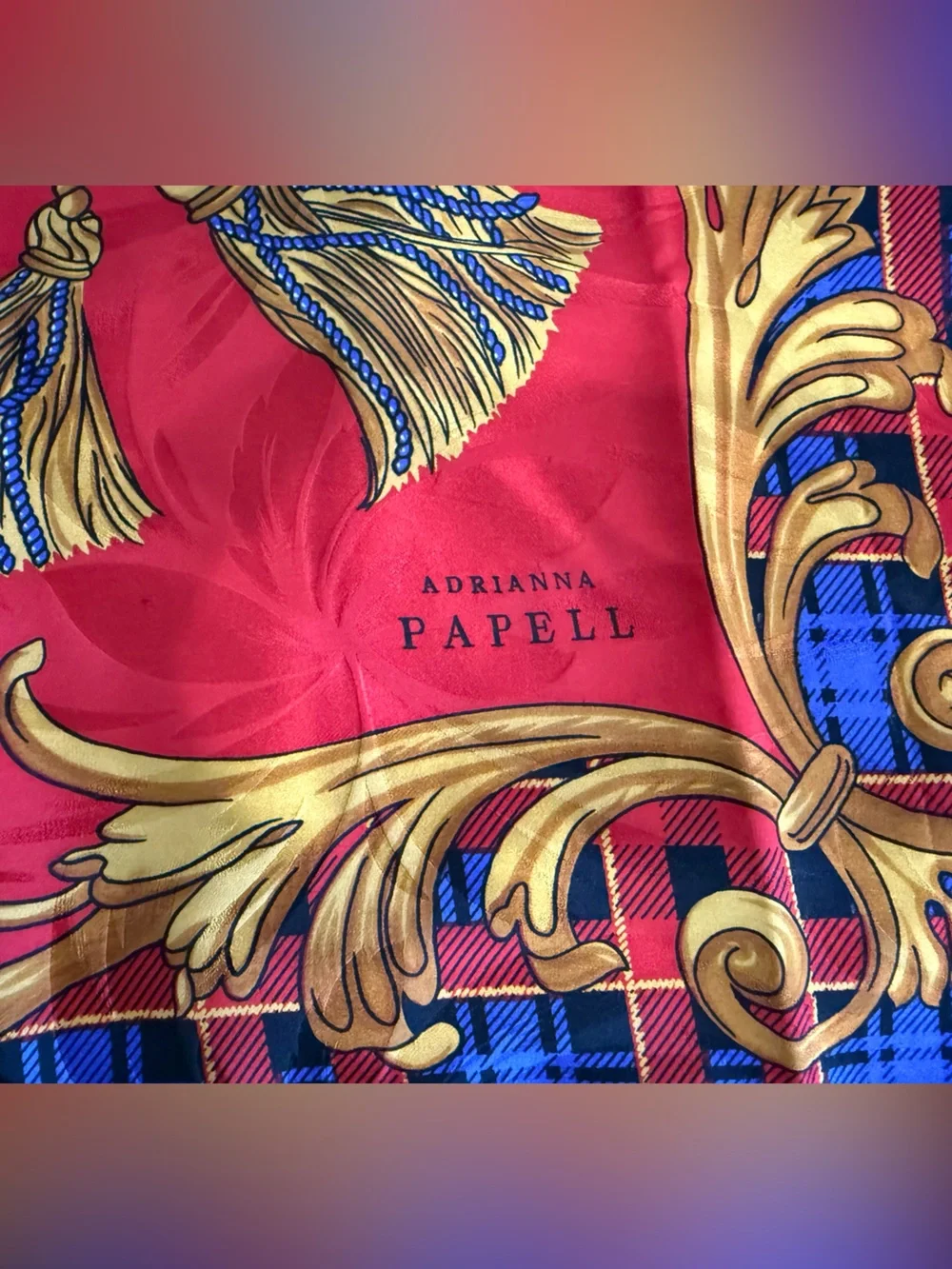 Adrianna Papell tartan background with baroque-style gold chain tassel scarf
